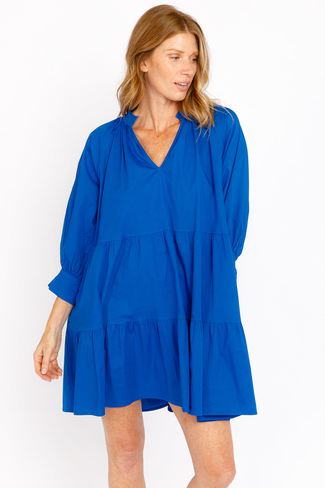 Woman wearing a blue dress on a white background