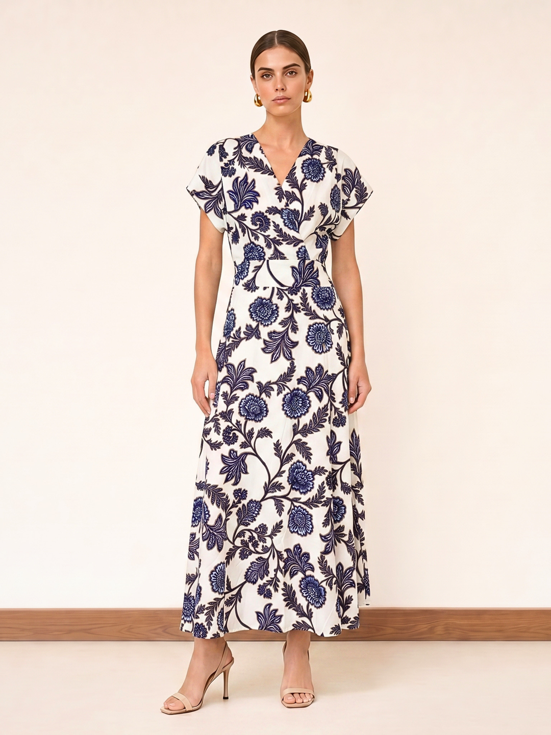 Woman wearing a floral dress with a plain background