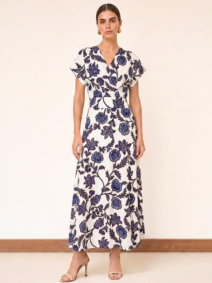 Woman wearing a floral dress with a plain background