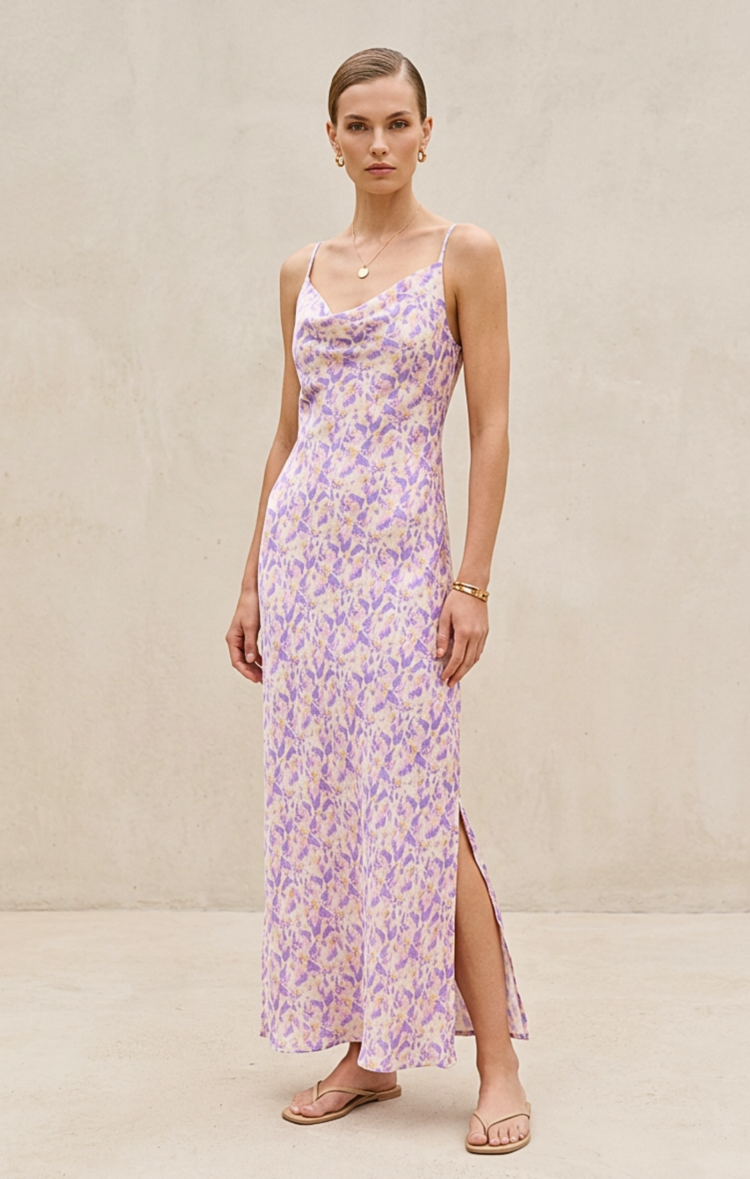 Woman wearing a floral dress with a plain background